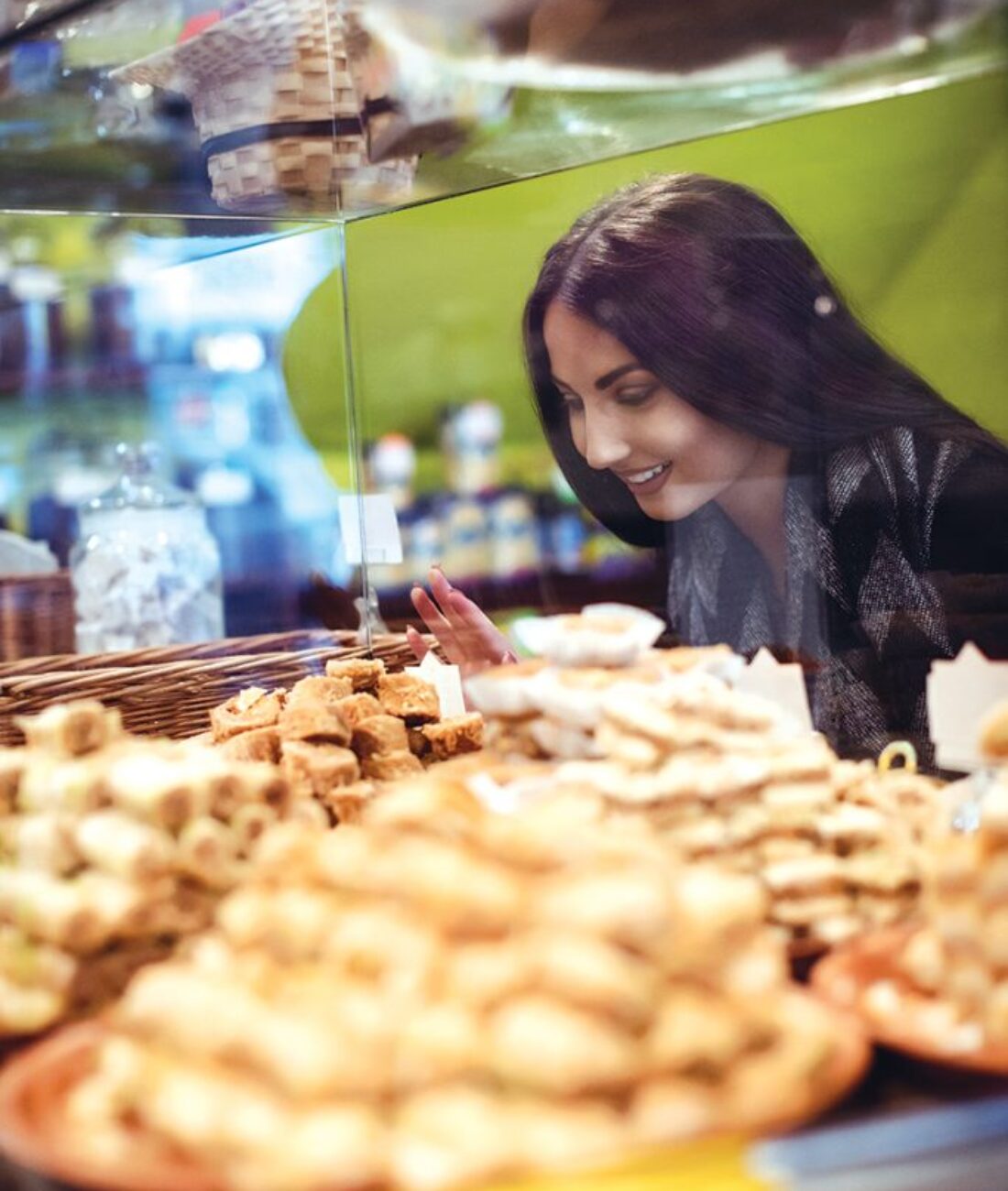 woman-looking-turkish-sweets-shop