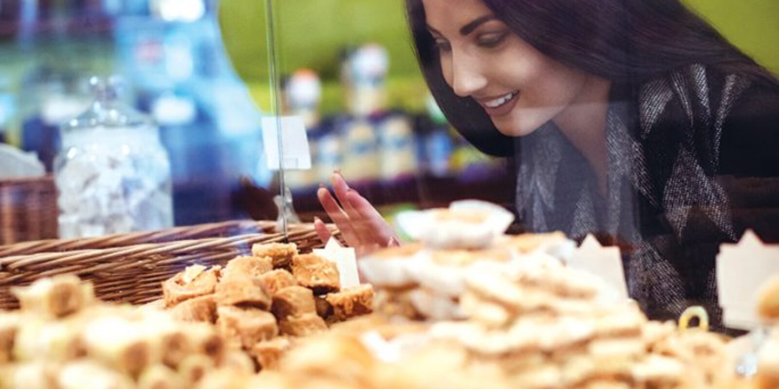 woman-looking-turkish-sweets-shop