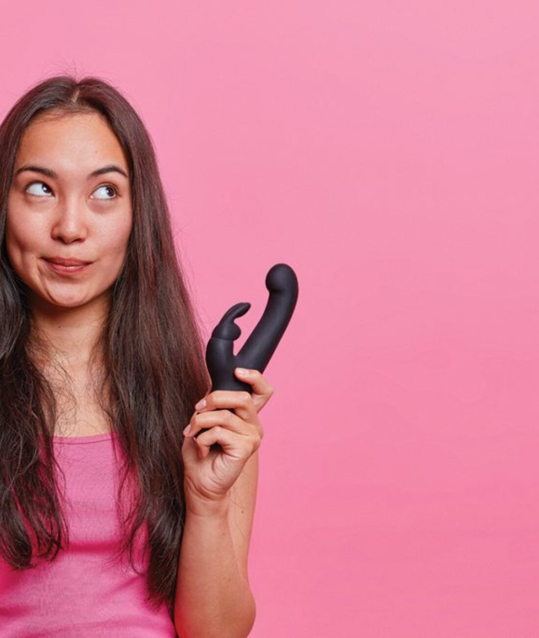 horizontal-shot-thoughtful-asian-woman-holds-rabbit-shaped-vibrator-uses-erotic-toy-pleasuring-buys-vibrating-sex-toys-adults-gets-relaxation-pleasure-vaginal-exercise-machine