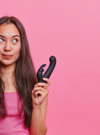 horizontal-shot-thoughtful-asian-woman-holds-rabbit-shaped-vibrator-uses-erotic-toy-pleasuring-buys-vibrating-sex-toys-adults-gets-relaxation-pleasure-vaginal-exercise-machine